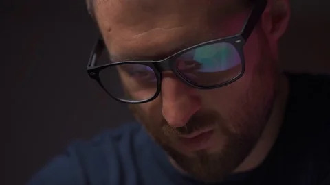 Reflection in Men's Glasses. Office routine, a man writes Stock Footage 127152335