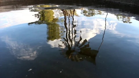 Reflection of mill on the water of a tank Stock Footage 88193114