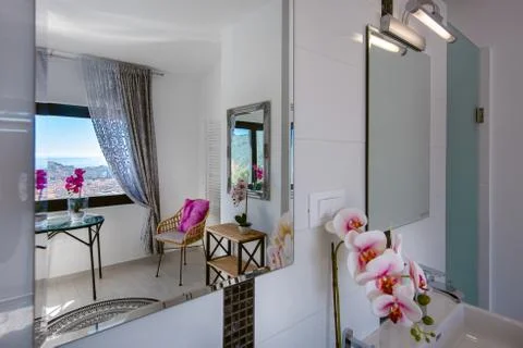 Reflection in the mirror in the bathroom Stock Photos