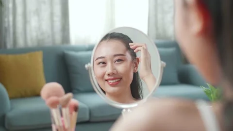 Reflection In A Mirror Beautiful Young Asian Woman Smiling And Fixing Her Hair Stock Footage 218320863