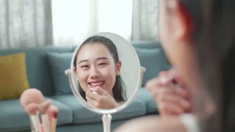 Reflection In A Mirror Beautiful Young Asian Woman Applying Lipstick Then Stock Footage 218320930