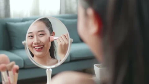 Reflection In A Mirror Beautiful Young Asian Woman Rouging Her Cheeks Stock Footage 218320972