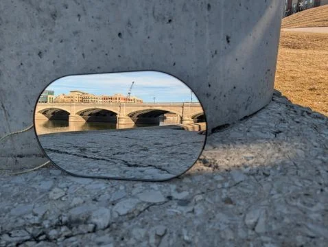 Reflection in a mirror of a bridge over water Photos
