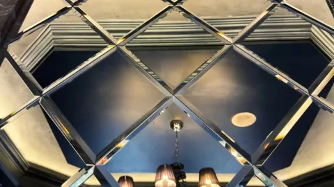 Reflection in the mirror of the ceiling and chandelier. Interior decor elements. Stock Footage 284239798