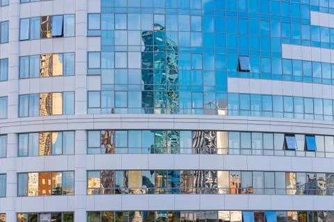 Reflection in the mirror facade of a multi-storey building Stock Photos