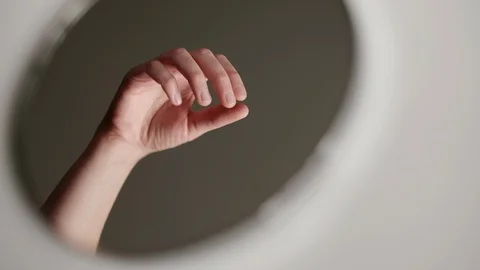 Reflection in the mirror of female hands applying perfume Stock Footage 104606112