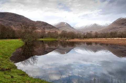 Reflection in mirror of mountain lake Stock Photos
