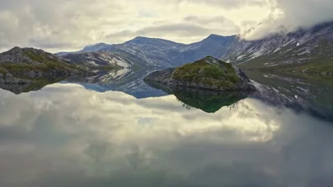Reflection mirror with rocks in lake amazing place Rago Stock Footage 141064138