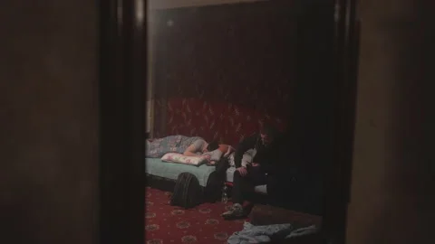 Reflection in the mirror of two guys going to bed Stock Footage 231711939