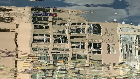 Reflection of a modern building in an artificial pond Stock Footage 128215109