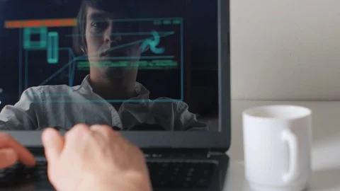Reflection in the monitor the programmer works at the computer and drinks coffee Stock Footage 74002841