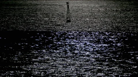 Reflection of moonlight sea with a lighted buoy. Stock Footage 67637083