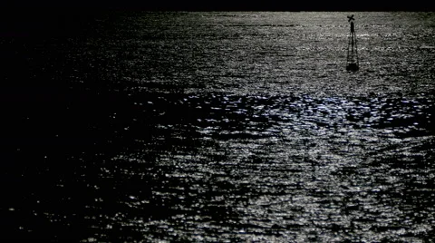 Reflection of moonlight sea with a lighted buoy. Stock Footage 67638044