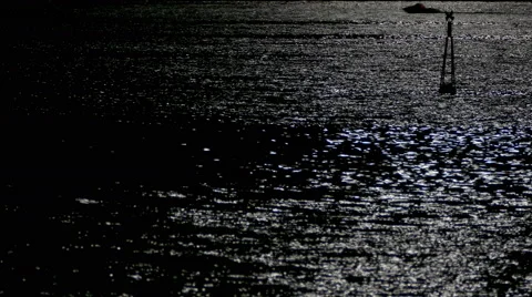 Reflection of moonlight sea with a lighted buoy. Stock Footage 67638176