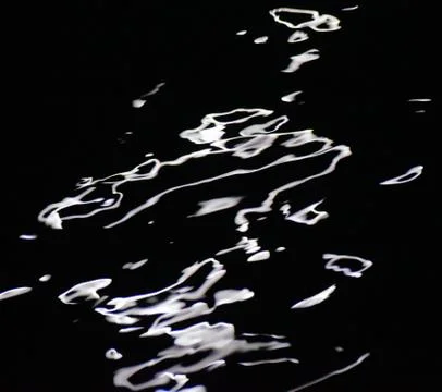 Reflection of moonlight in the water. Abstraction. Background. Stock Photos