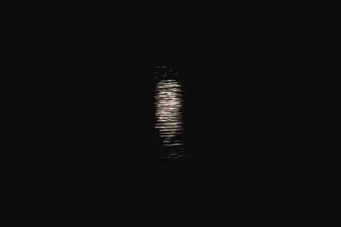 Reflection of the moonlight on the water Stock Photos