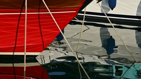Reflection of moored yachts in the clear blue water of the sea port Stock Footage 317340837