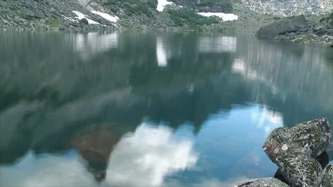Reflection in a mountain lake Stock Footage 83696000