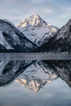 Reflection mountain peak in the lake Stock Photos