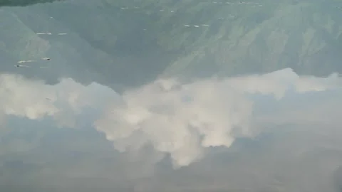Reflection of Mountains and Clouds in Dal Lake, Srinagar, Kasmir, India Video stock 285117713