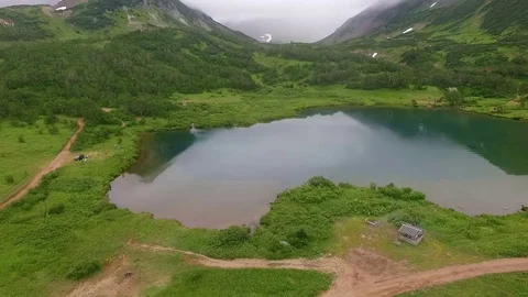 Reflection of mountains in the lake. Lake view from the top Stock Footage 72607396