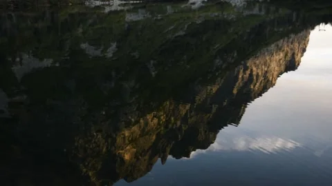 Reflection of mountains on the surface of the mountain lake Stock Footage 132251460