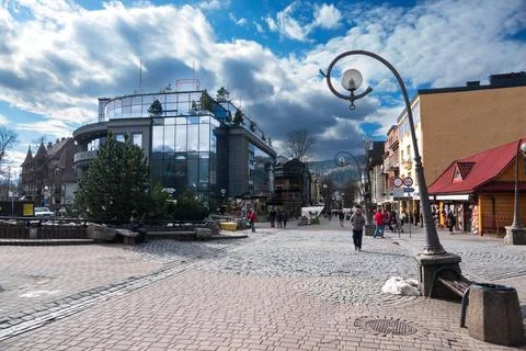 Reflection of mountains in windows of the building Krupowki street. Zakopan.. Stock Photos