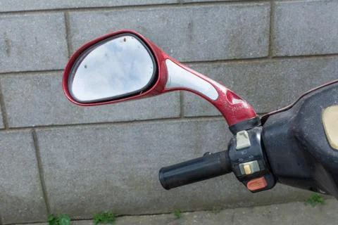 Reflection of the nab and clouds in the motorcycle mirror, moped elements. Mo Stock Photos