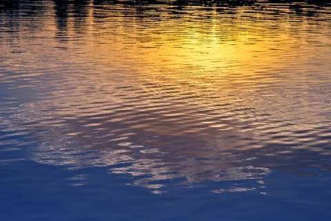 Reflection of night city lights in the river Stock Photos