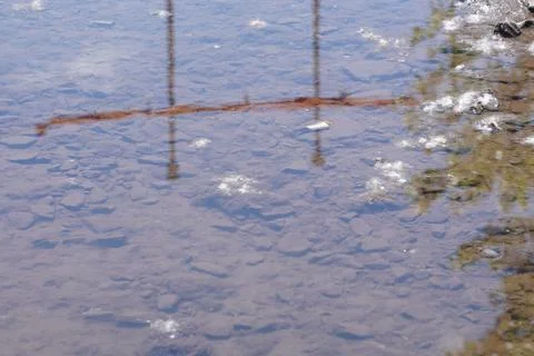 A reflection of an object on a water surface. Stock Photos