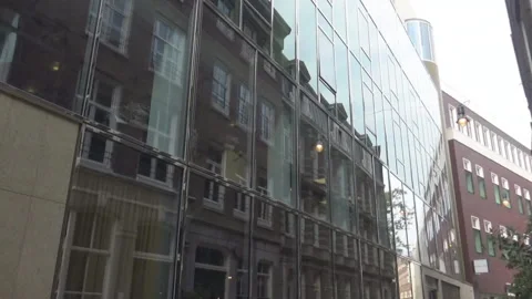 Reflection of an old building in a glass one Stock Footage 95721703