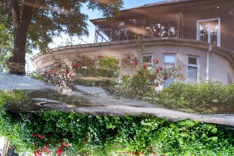 Reflection of old house in the garden Stock Photos
