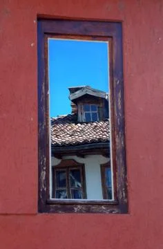 Reflection in the Old House Window Stock Photos