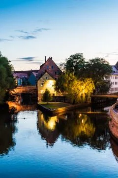 Reflection of old mill in water at sunset sunrise Foto stock