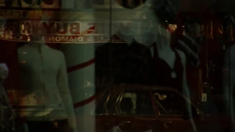 Reflection of passersby on shopping window Stock Footage 87042727