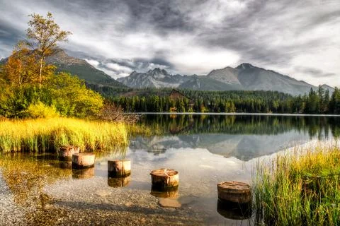 Reflection of peaks on water surface of tarn Strbske pleso in High Tatras mou Stock Photos