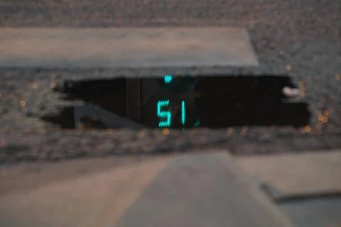 Reflection of a pedestrian traffic light in a puddle 库存照片