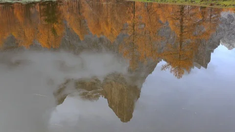 Reflection of the Pelmo Mountain on a small lake, Autumn Stock-Footage 129814265