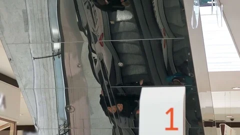 Reflection of people on the escalator going up Stock Footage 75159386