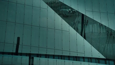 The reflection of people in a glass building Stock Footage 285816714