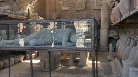 Reflection of people on plaster body cast of victim killed in Pompeii Italy Stock Footage 113260001