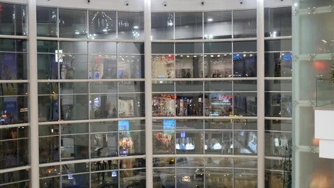 Reflection of people in the shopping mall window Stock Footage 98345318