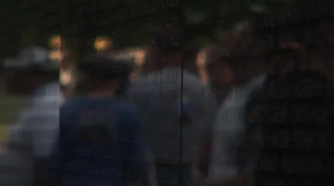 Reflection of people visiting the Vietnam Wall rack to names Stock Footage 41555871