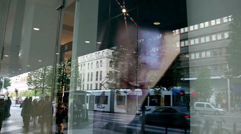 Reflection of people on the window of a store showing fashion movie. Stock Footage 45161124