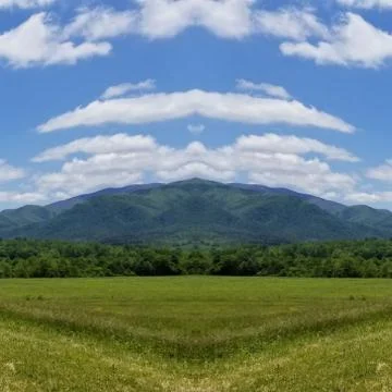 Reflection Photo Collage of Cloud Shadows on Mountainside in May Foto stock