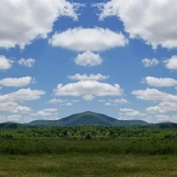 Reflection Photo Collage of Cloud Shadows on Mountainside in May Foto stock