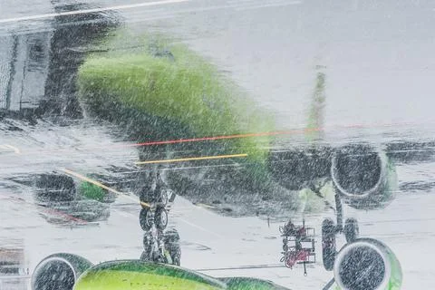 Reflection of the plane on the asphalt Stock Photos