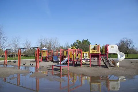 Reflection of the playground at the public park in springtime Stock Photos