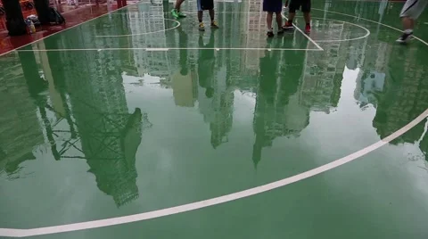 Reflection of playing basketball in the wet surface after rain playground, Hong Stock Footage 50669406