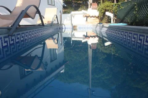 Reflection in a pool in the summer Stock Photos